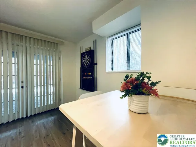 a close view of dining table with chairs