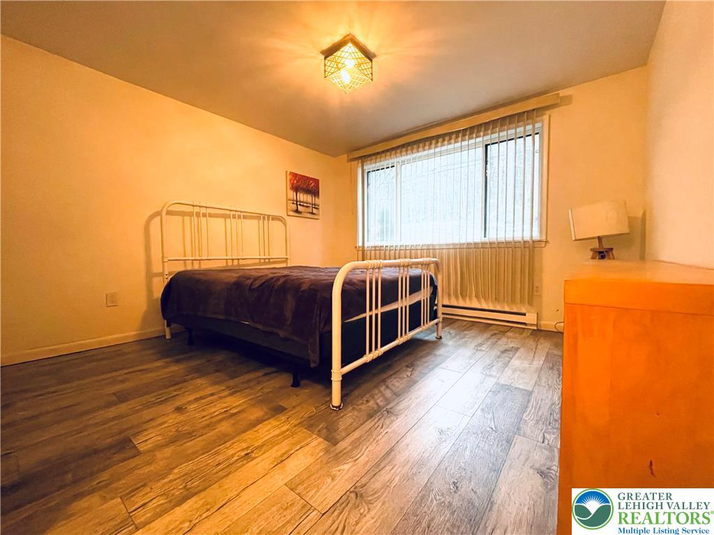 3104 Northgate Road Lake Ariel, PA 18436 - Photo 24 of 36 a view of a bedroom with a bed and wooden floor
