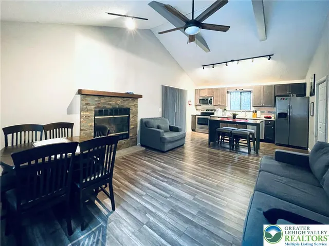 a view of a dining room with furniture window and wooden floor