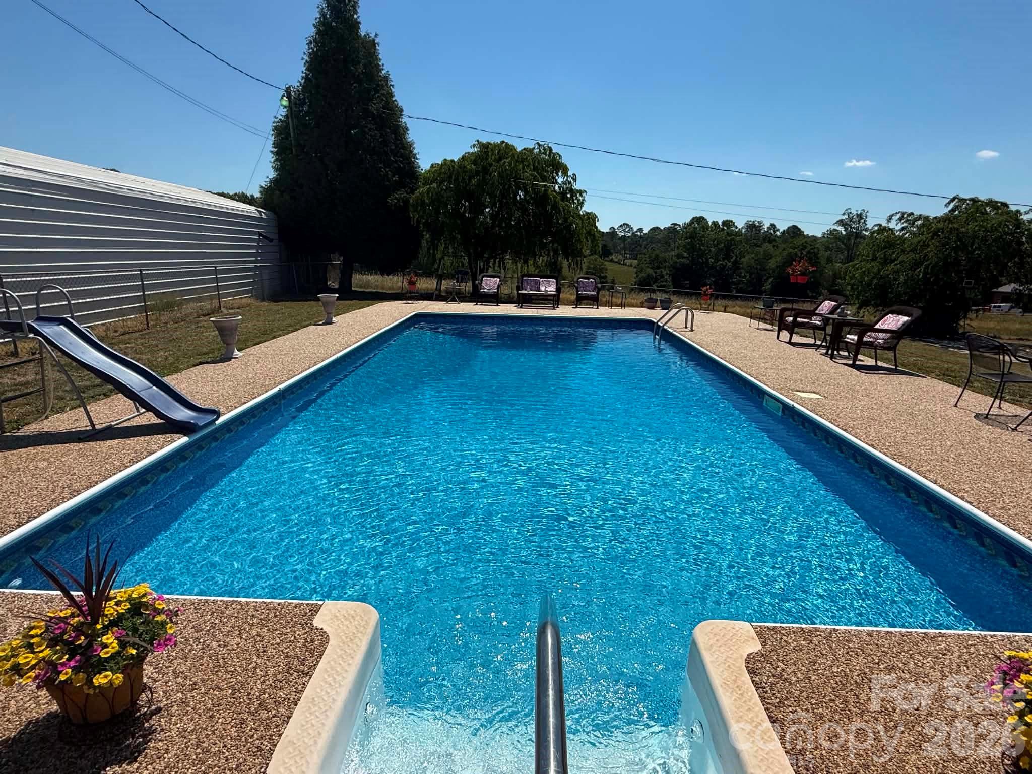 2121 Union Grove Road Lenoir, NC 28645 - Photo 6 of 38 a view of a backyard with sitting area