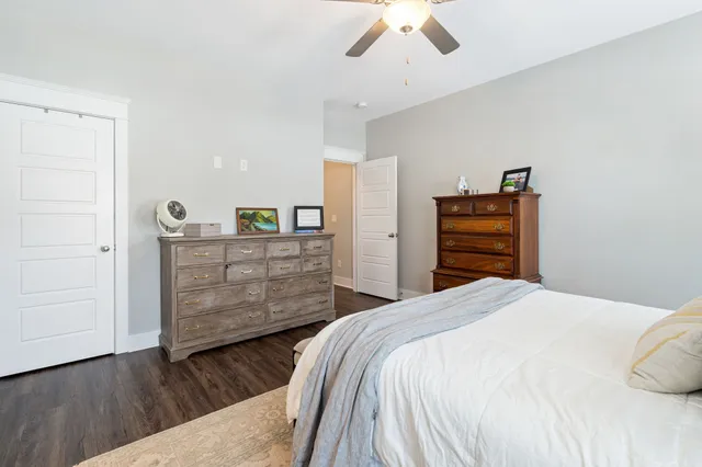a bedroom with a bed and a dresser