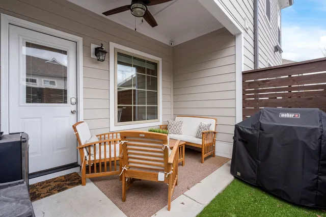 a balcony with furniture and a window