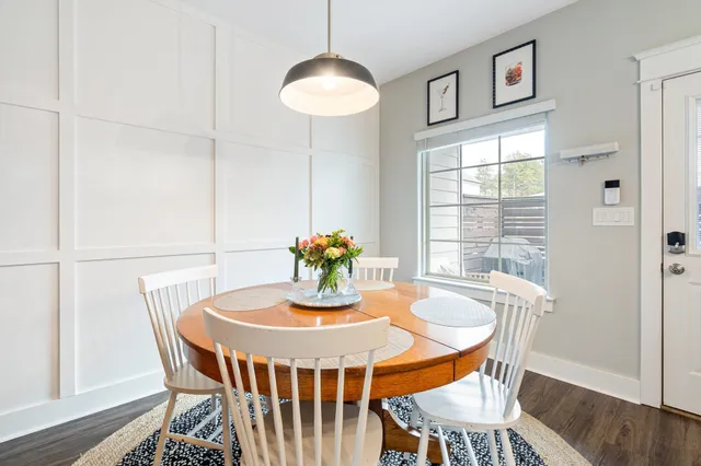 a dining room with furniture and window