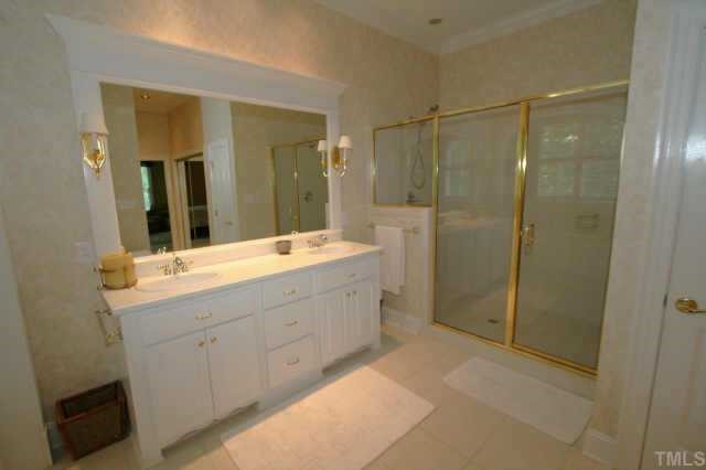 7125 Trenton Ridge Court Raleigh, NC 27613 - Photo 7 of 10 a bathroom with a double vanity sink mirror and double