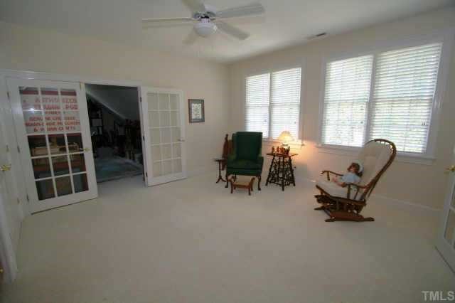 7125 Trenton Ridge Court Raleigh, NC 27613 - Photo 8 of 10 a view of a livingroom with workspace and a window