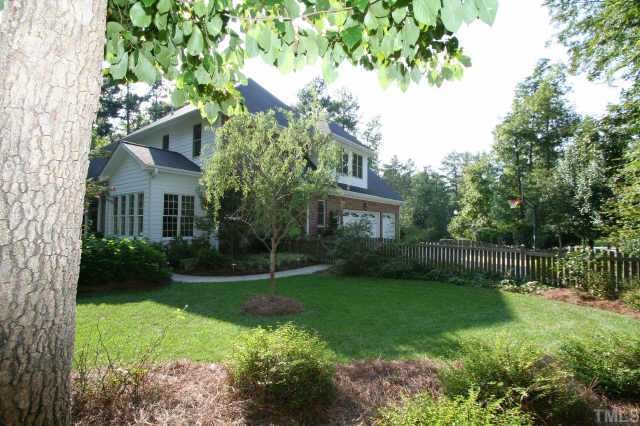 7125 Trenton Ridge Court Raleigh, NC 27613 - Photo 9 of 10 a view of a house with a yard and a garden