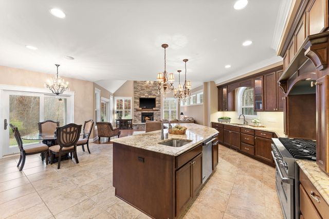 a living room with fireplace furniture and a fireplace