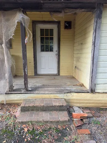 a view of entrance gate of a house