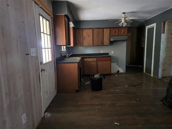a kitchen with stainless steel appliances granite countertop a refrigerator and a stove
