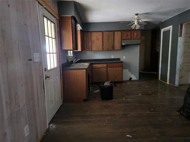 a kitchen with stainless steel appliances granite countertop a refrigerator and a stove