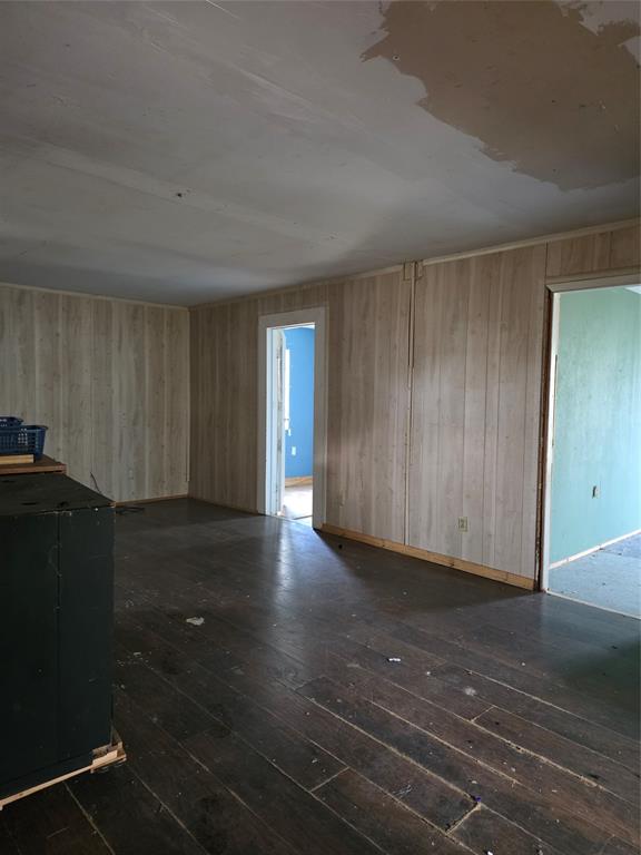3830 County Road 4040 Whitewright, TX 75491 - Photo 15 of 27 a view of a closet area with hardwood floor