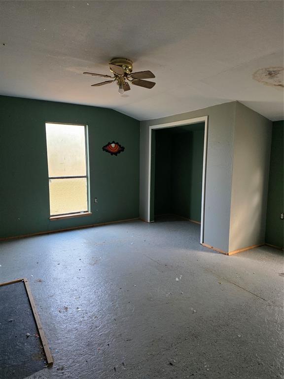 3830 County Road 4040 Whitewright, TX 75491 - Photo 16 of 27 a view of an empty room with a window