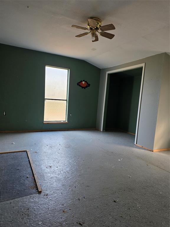 3830 County Road 4040 Whitewright, TX 75491 - Photo 17 of 27 a view of a livingroom with a ceiling fan and window