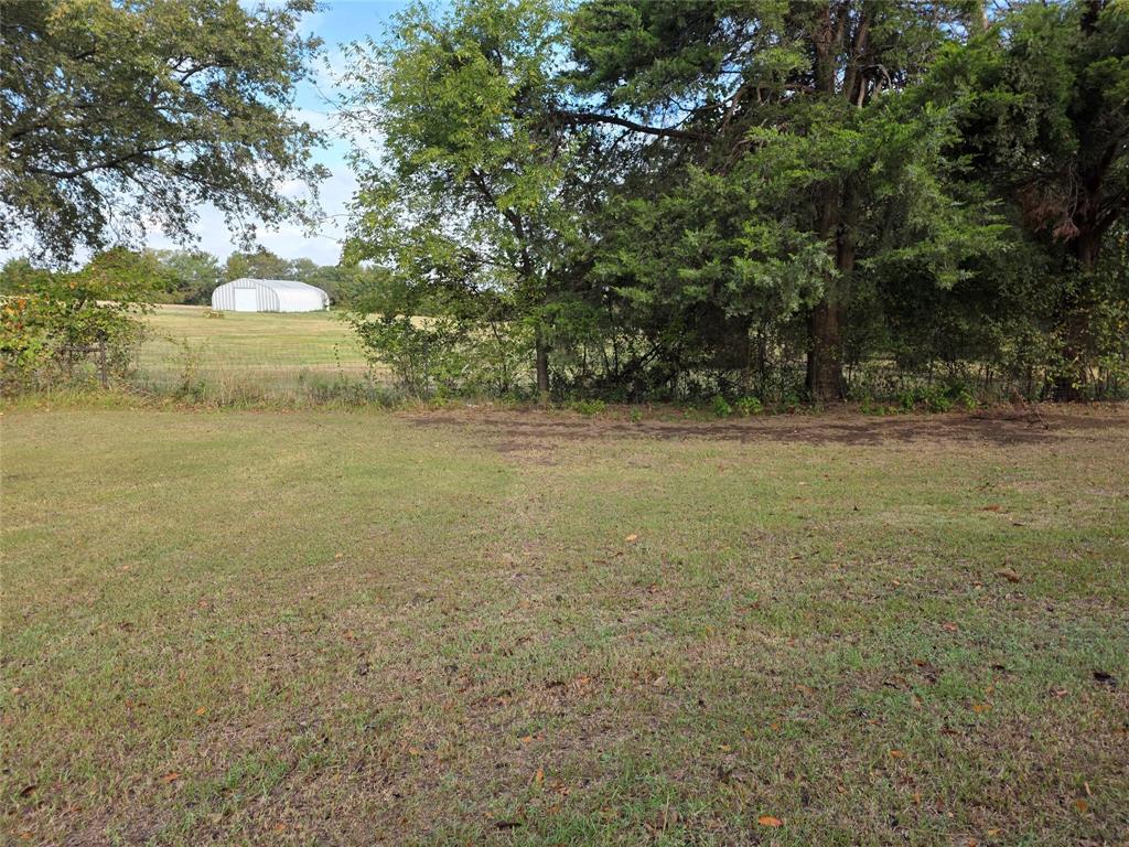 3830 County Road 4040 Whitewright, TX 75491 - Photo 4 of 27 a view of a field with an trees