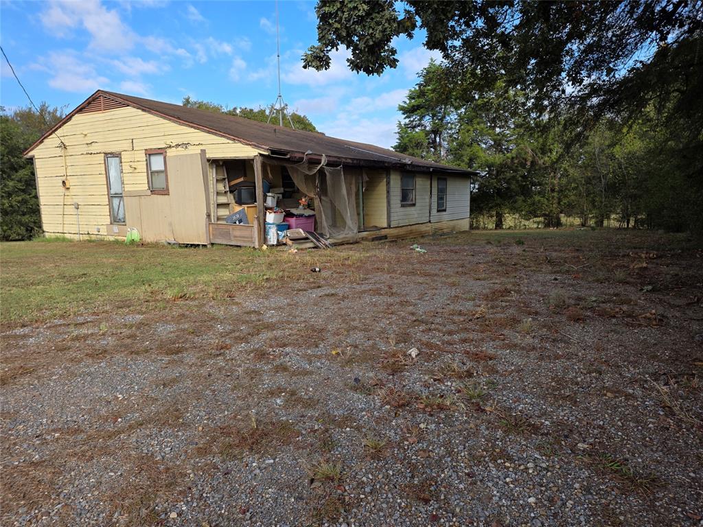 3830 County Road 4040 Whitewright, TX 75491 - Photo 9 of 27 a view of a house with a outdoor space