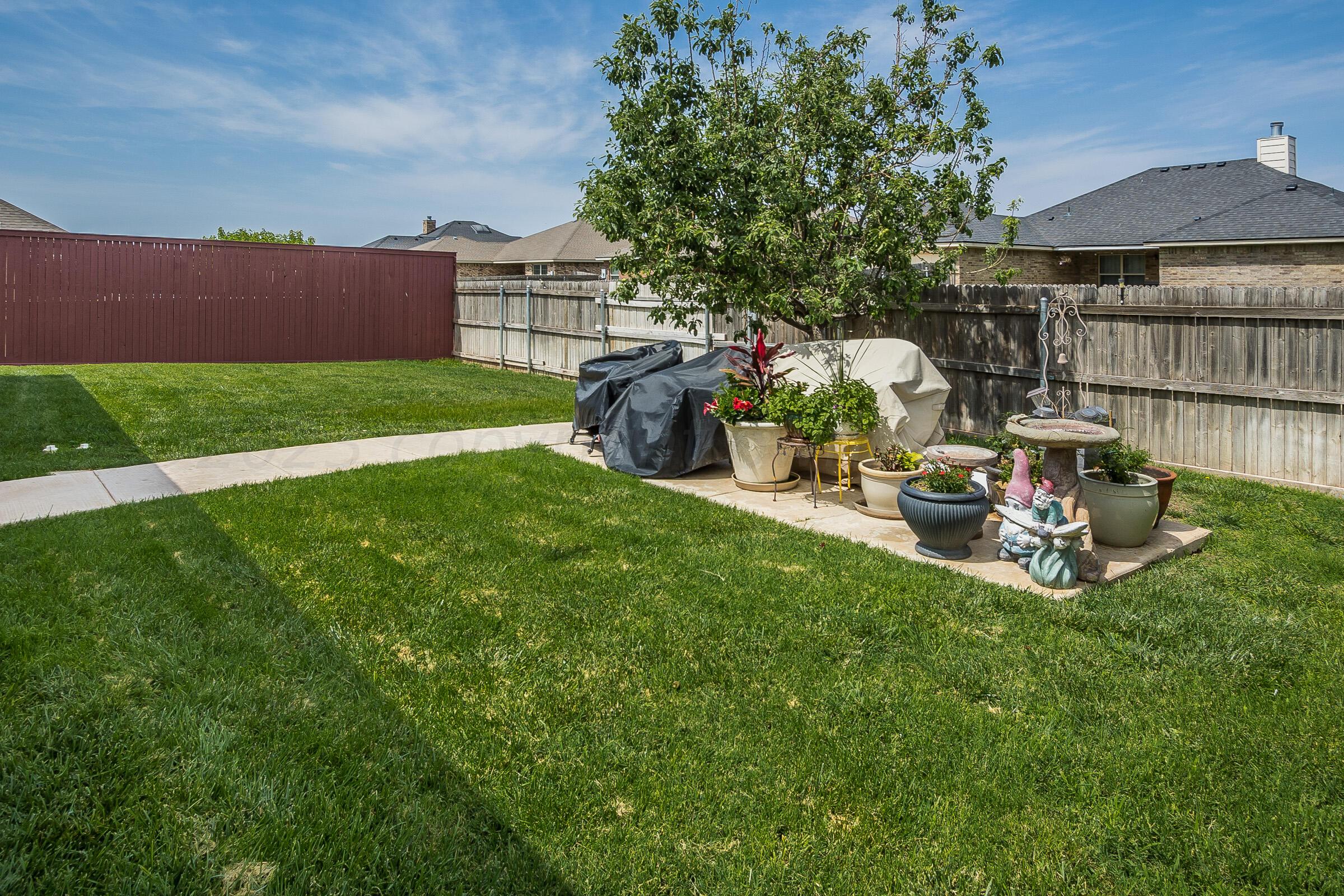 6502 Lexis Street Amarillo, TX 79119 - Photo 22 of 27 a view of a house with backyard porch and sitting area