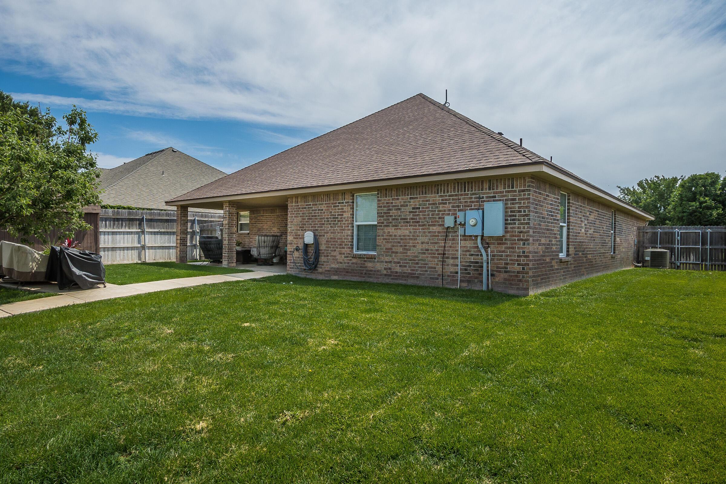 6502 Lexis Street Amarillo, TX 79119 - Photo 23 of 27 a front view of house with yard and outdoor seating