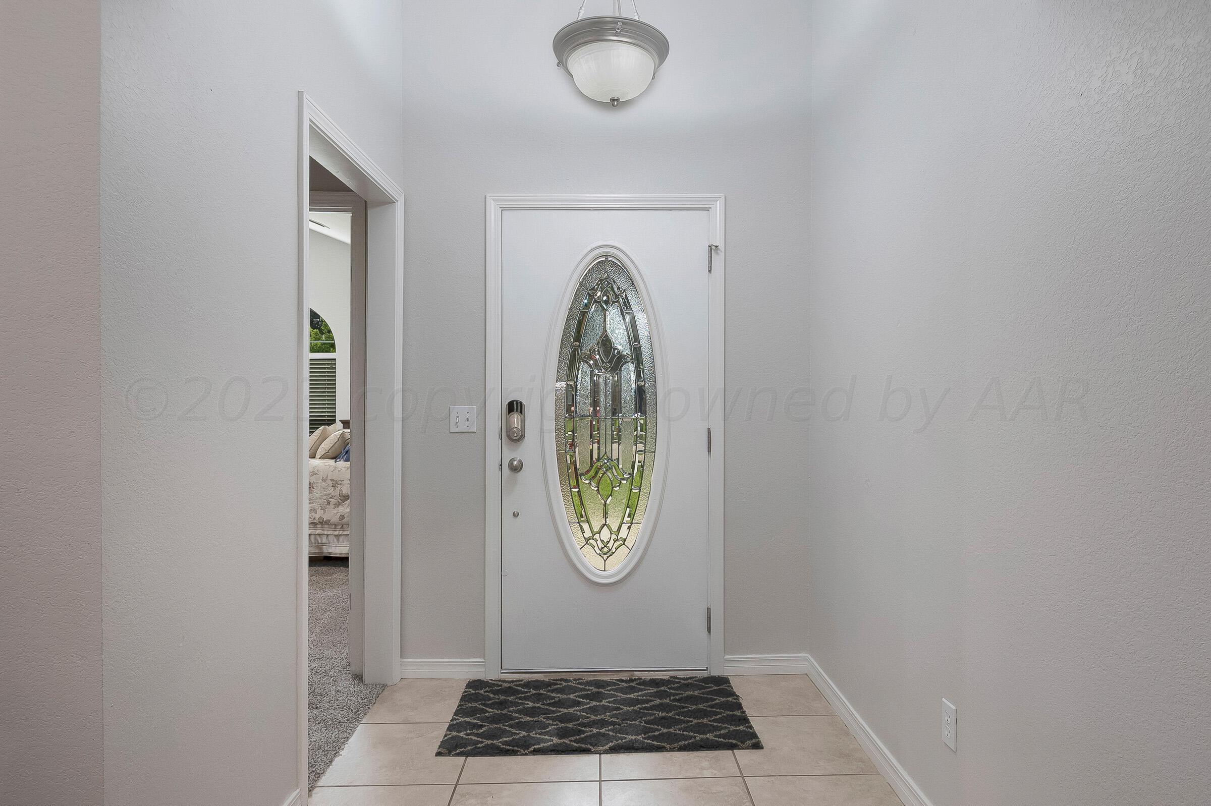 6502 Lexis Street Amarillo, TX 79119 - Photo 3 of 27 a view of entryway with wooden floor