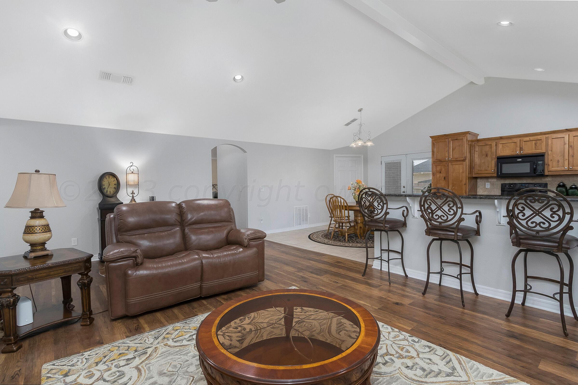 6502 Lexis Street Amarillo, TX 79119 - Photo 5 of 27 a living room with furniture and a wooden floor