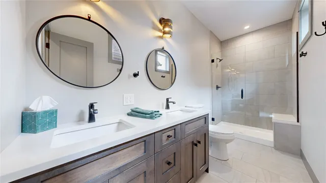a bathroom with a toilet a sink and a mirror