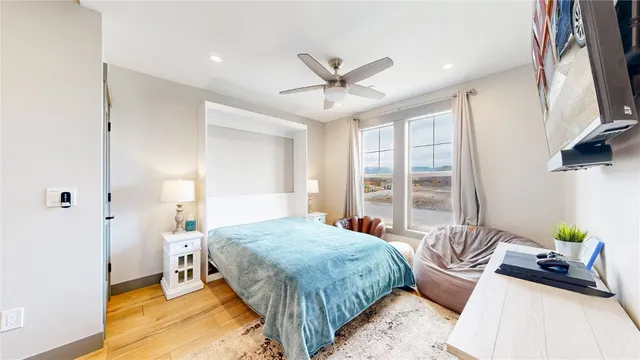 a spacious bedroom with a bed and a couch