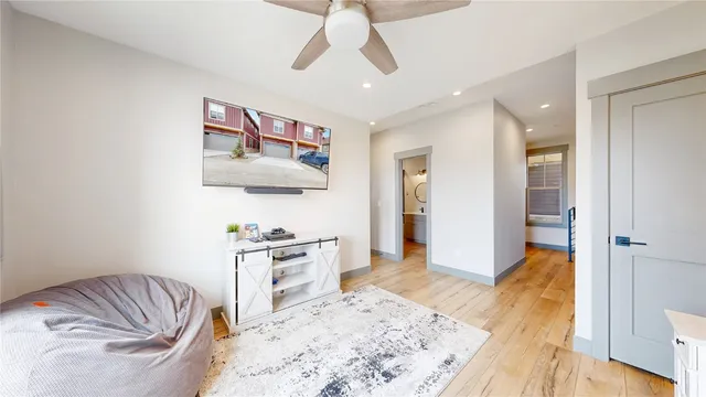 a bedroom with a bed and a couch