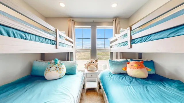 a bedroom with furniture and a wooden floor