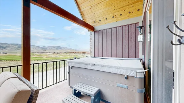 a view of roof deck with wooden fence