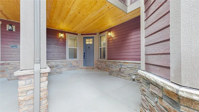 a view of a deck with wooden floor and iron fence