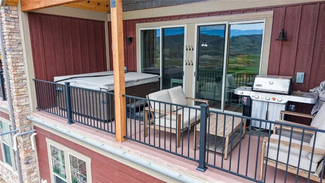 a view of a house with wooden fence