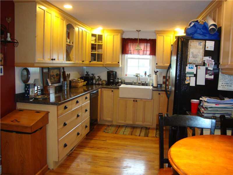 845 Hecla Road Mount Pleasant, PA 15666 - Photo 8 of 18 Kitchen. 3 walls of kitchen cabinets + oak, hardwood flooring