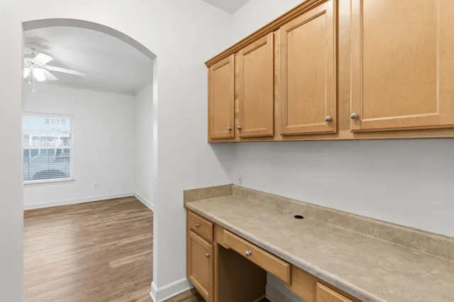 a view of cabinets and wooden floor