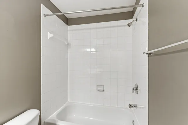 a bathroom with a shower and a bathtub