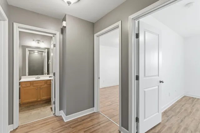 a view of a bathroom from a hallway