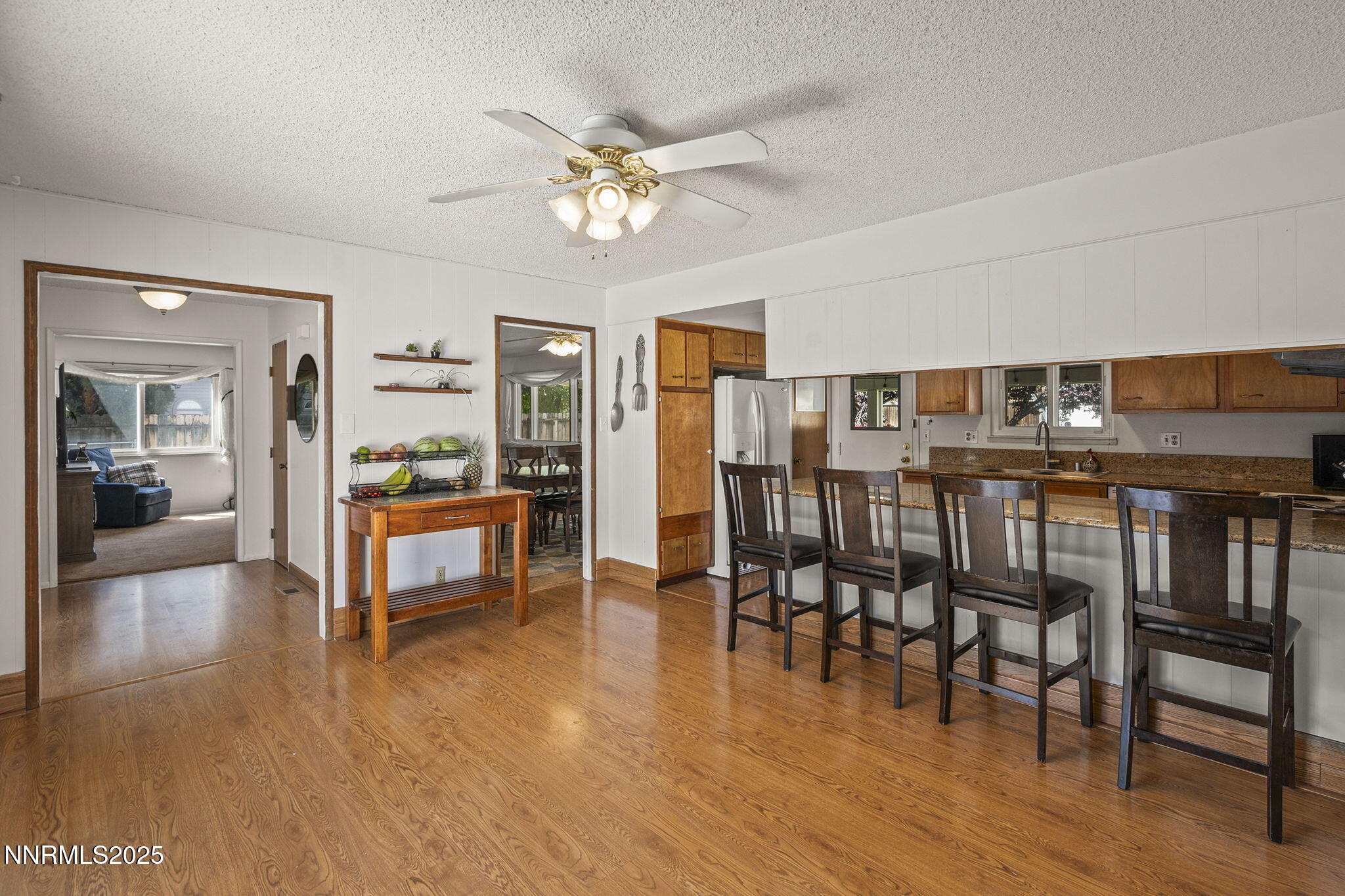 11070 Broken Hill Road Reno, NV 89511 - Photo 16 of 32 a living room with stainless steel appliances lots of furniture and chandelier