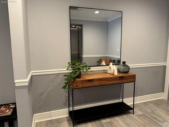a room with a table and a mirror