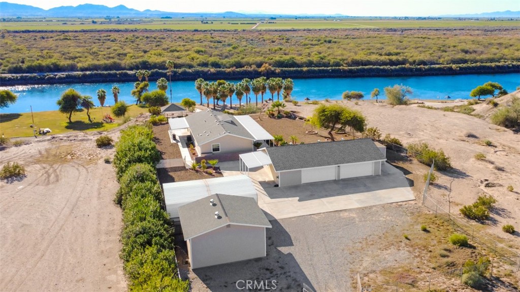 an aerial view of a house with a ocean view
