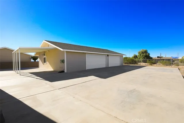 a backyard of a house with a garage