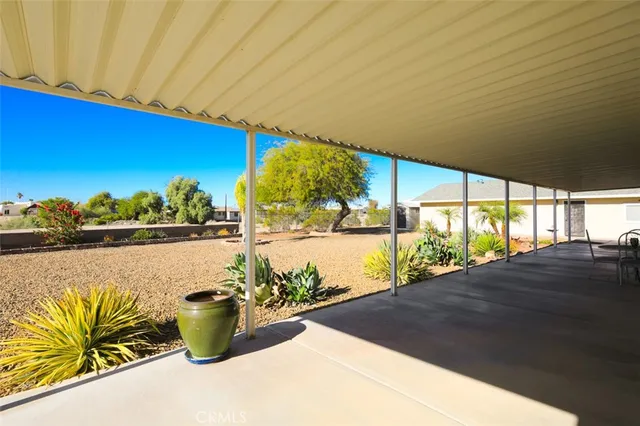 a view of a dining room with furniture and windows