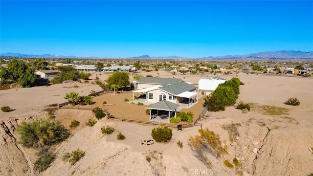 an aerial view of a house with a ocean view