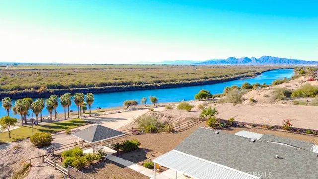 an aerial view of a house with a ocean view