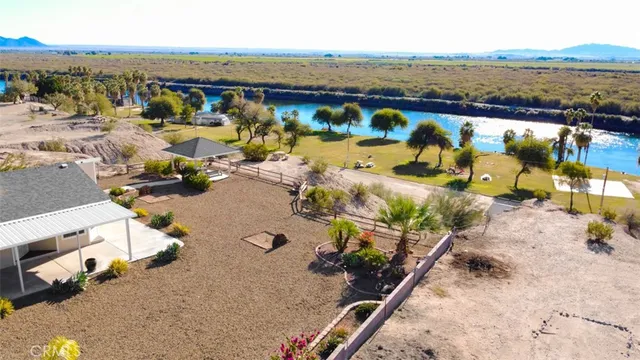 an aerial view of a house with a ocean view
