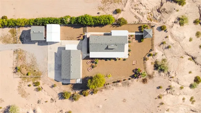 an aerial view of a house with a ocean view