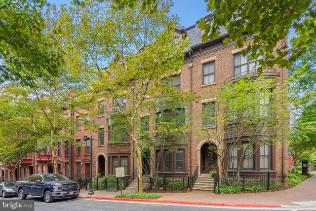 a front view of a building with street view
