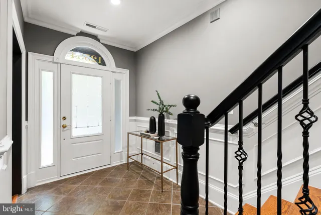 a view of an entryway with wooden floor