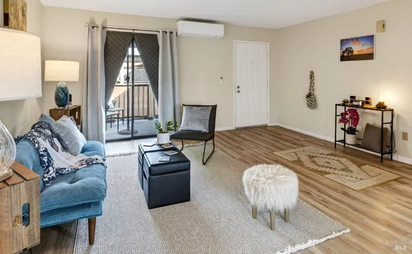 a bed room with a bed and a chair