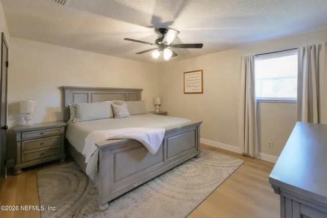 a bedroom with a bed and a walk in closet