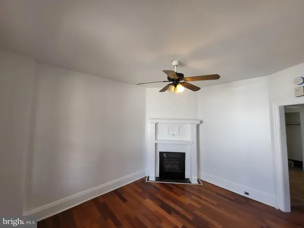 a view of empty room with fireplace