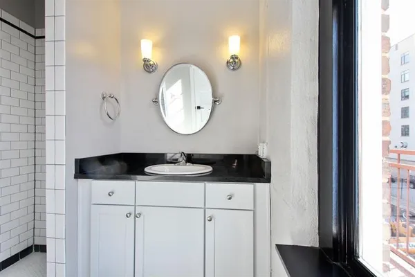 a bathroom with a sink and a mirror