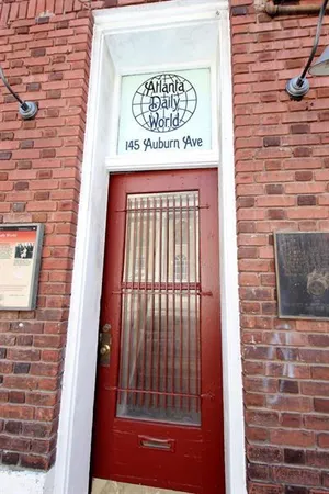 a sign on the brick wall